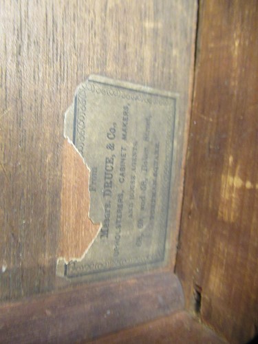 Lot 616 - A Victorian walnut canterbury