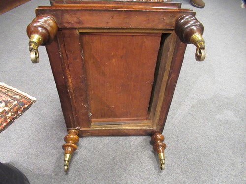 Lot 616 - A Victorian walnut canterbury