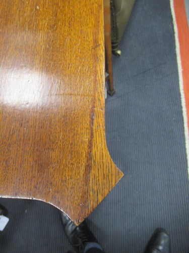 Lot 621 - A revolving oak book stand, early 20th century