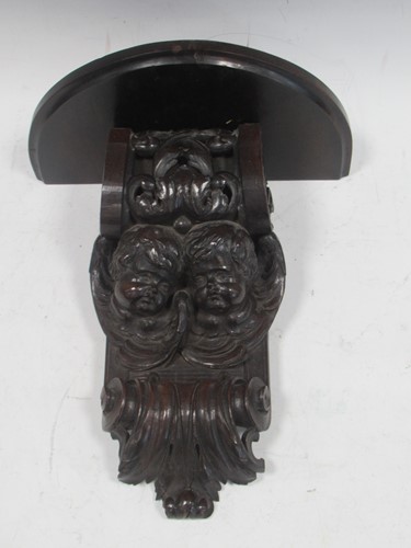 Lot 58 - A 19th century carved corbel adapted with a...