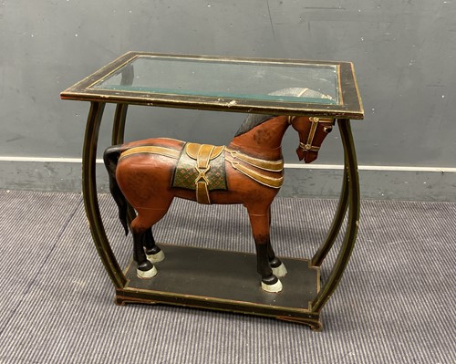 Lot 335 - A painted glass top side table with a carved...