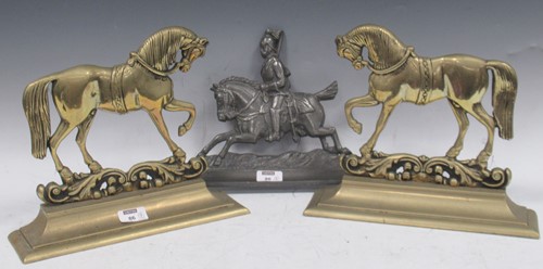 Lot 86 - A pair of brass and door stops modelled as...