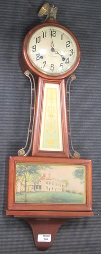 Lot 164 - A mahogany cased New Haven wall clock 74cm high
