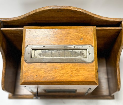 Lot 589 - A Victorian oak hall letter box and rack