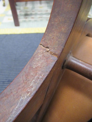 Lot 590 - A Spanish style leather covered chair and foot stool, late 20th century