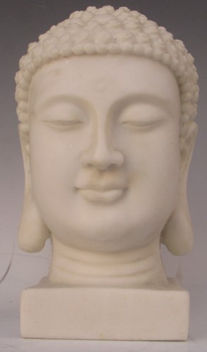 Lot 9 - A reconstituted marble Buddha head