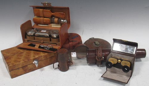 Lot 107 - A collection of leather cased items: Telescope;...