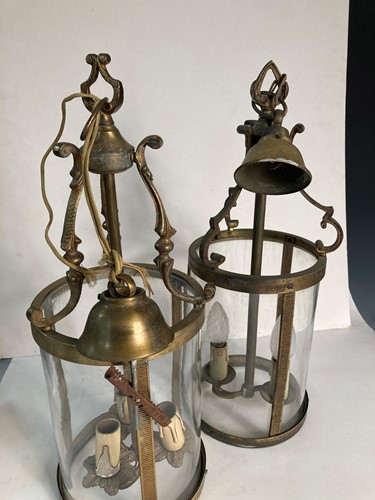 Lot 539 - A near pair of cylindrical brass hall lanterns, early 20th century