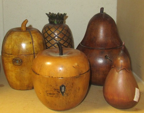 Lot 15 - A collection of five fruitwood tea caddies in...