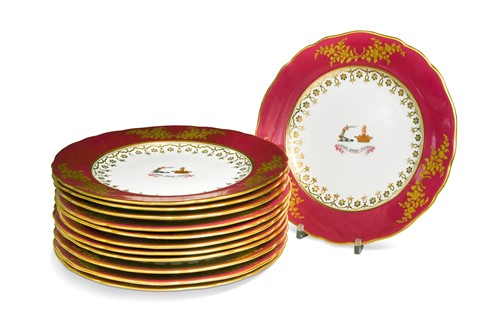 Lot 543 - A set of twelve English porcelain armorial plates, circa 1825