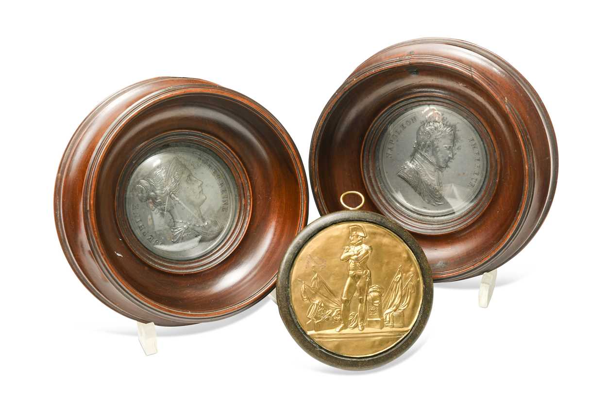 Lot 519 - A pair of framed white metal medallions of Napoleon and Josephine, 19th century