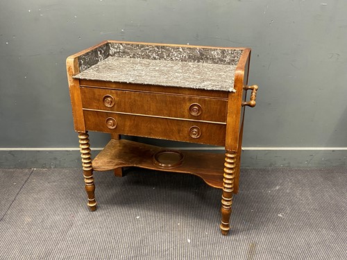 Lot 373 - An early 20th century washstand with fossil...