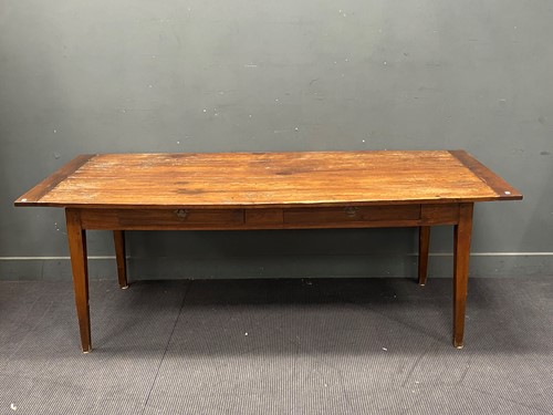 Lot 399 - A French fruitwood dining table with plank top...