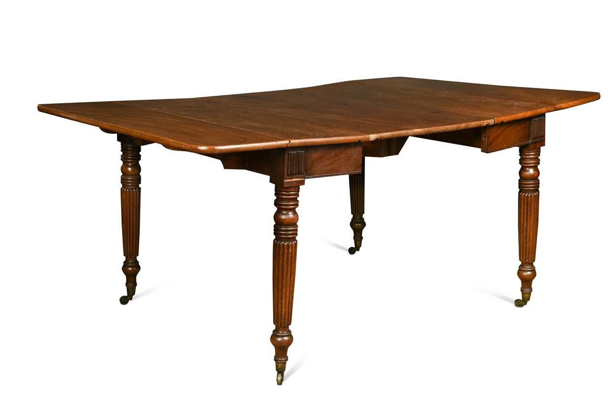 Lot 827 - A late Regency mahogany scissor action dining table in the manner of Gillows