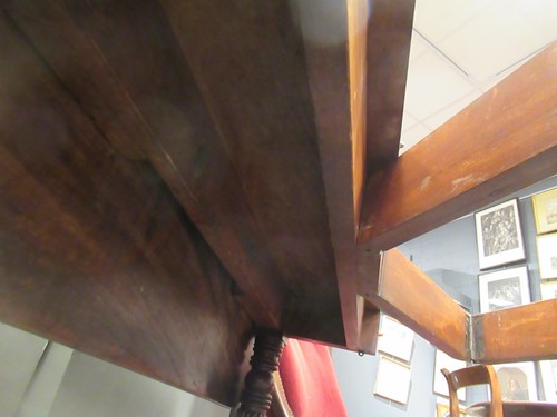 Lot 827 - A late Regency mahogany scissor action dining table in the manner of Gillows