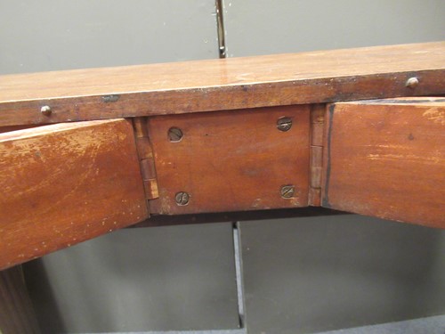 Lot 827 - A late Regency mahogany scissor action dining table in the manner of Gillows