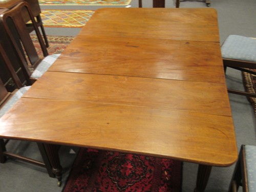 Lot 827 - A late Regency mahogany scissor action dining table in the manner of Gillows