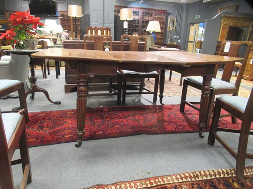 Lot 827 - A late Regency mahogany scissor action dining table in the manner of Gillows