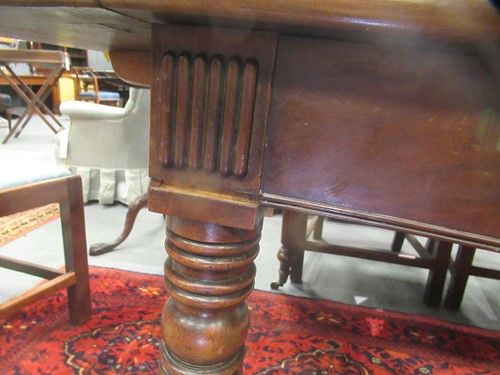 Lot 827 - A late Regency mahogany scissor action dining table in the manner of Gillows
