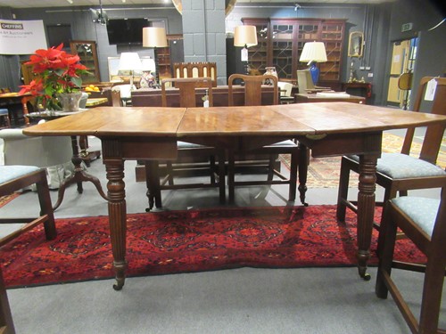 Lot 827 - A late Regency mahogany scissor action dining table in the manner of Gillows