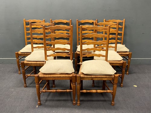 Lot 356 - A set of eight oak ladder back dining chairs,...