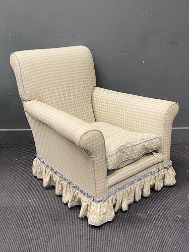 Lot 451 - An Edwardian easy armchair, reupholstered, on...