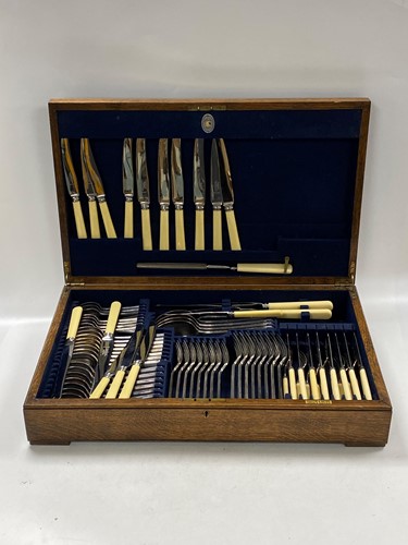 Lot 204 - An oak canteen of silver plated flatware by...