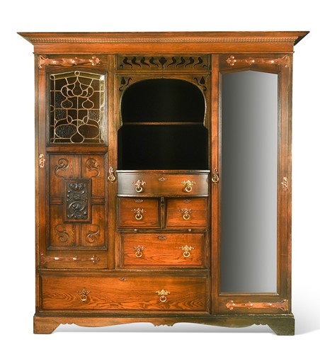 Lot 182 - An Arts & Crafts stained ash wardrobe in the manner of Shapland and Petter