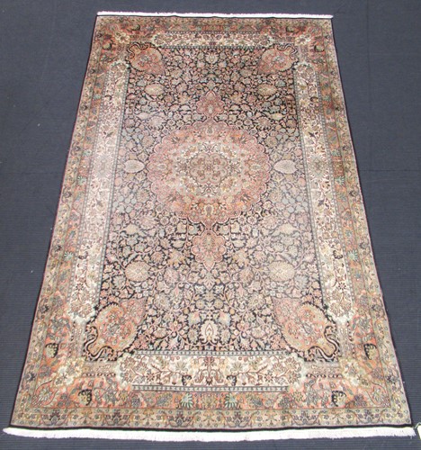 Lot 510 - A Tabriz silk carpet measures 298 x 180 cm