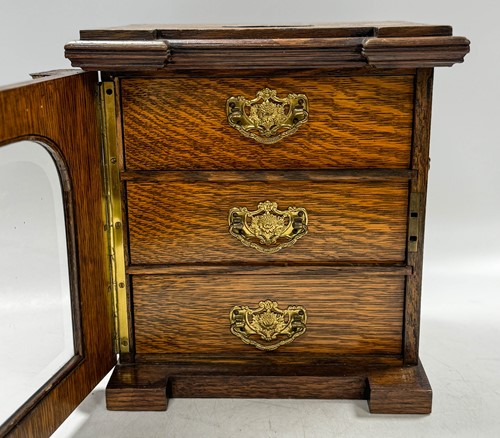 Lot 593 - A late Victorian brass mounted oak table top collector's cabinet