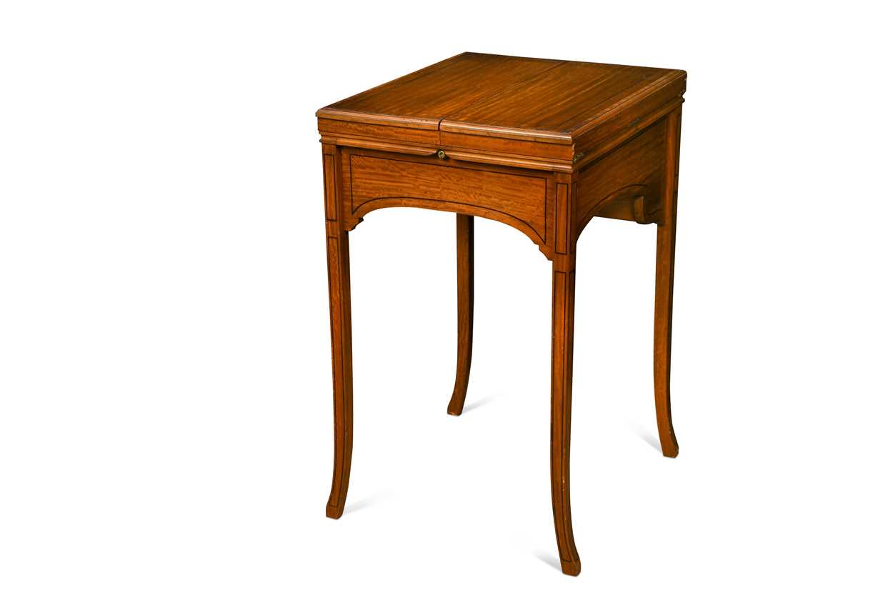 Lot 616 - An Edwardian satinwood pop up writing table