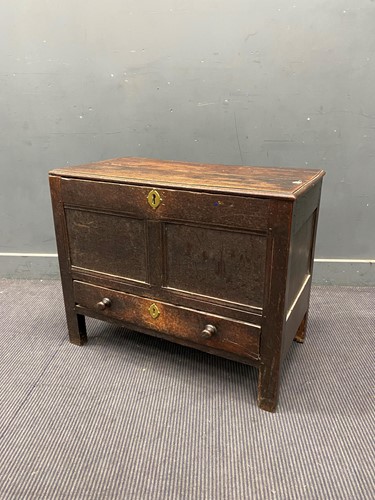 Lot 332 - An elm and oak chest with hinged lid and two...