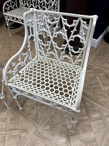 Lot 628 - A pair of cast iron garden seats together with a pair of garden chairs, 20th century