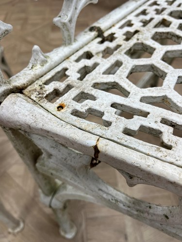 Lot 628 - A pair of cast iron garden seats together with a pair of garden chairs, 20th century