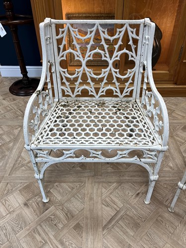 Lot 628 - A pair of cast iron garden seats together with a pair of garden chairs, 20th century