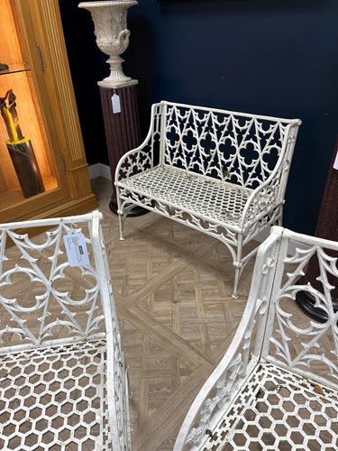Lot 628 - A pair of cast iron garden seats together with a pair of garden chairs, 20th century