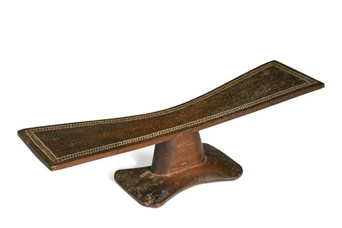 Lot 236 - A carved wood headrest, probably African, late 19th or early 20th century