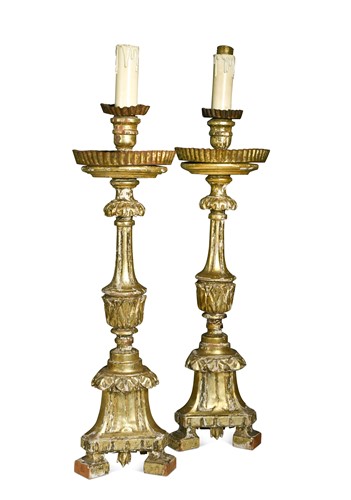 Lot 330 - A pair of Italian carved giltwood candlesticks, 18th century and later