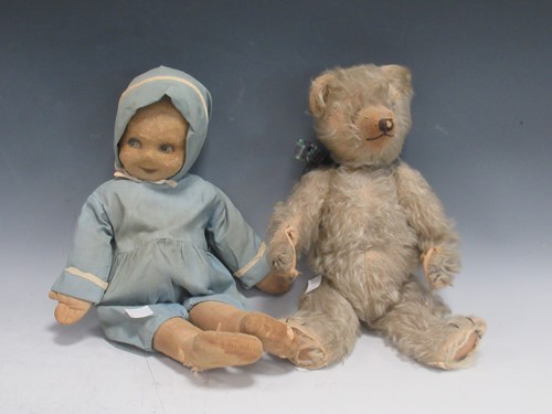 Lot 183 - A Deans Ragbook Co doll with in blue rompers...