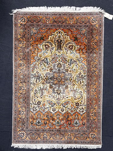 Lot 784 - A modern Tabriz rug, with meandering florals...