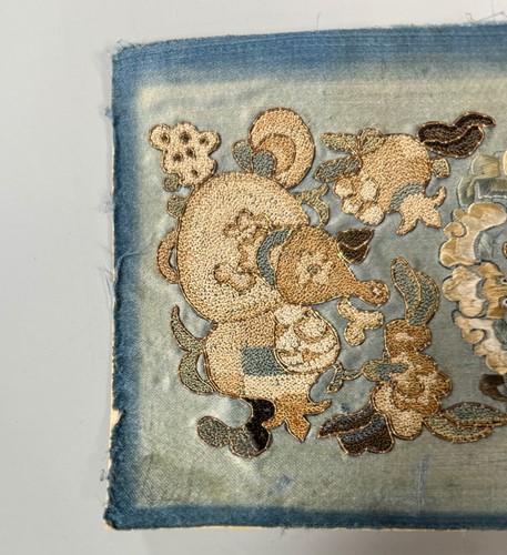 Lot 20 - A Chinese child's blue silk embroidered jacket, early 20th century