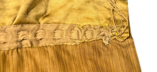 Lot 20 - A Chinese child's blue silk embroidered jacket, early 20th century