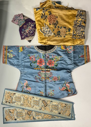 Lot 20 - A Chinese child's blue silk embroidered jacket, early 20th century