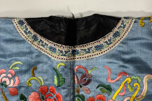 Lot 20 - A Chinese child's blue silk embroidered jacket, early 20th century