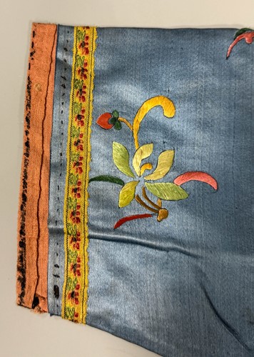 Lot 20 - A Chinese child's blue silk embroidered jacket, early 20th century