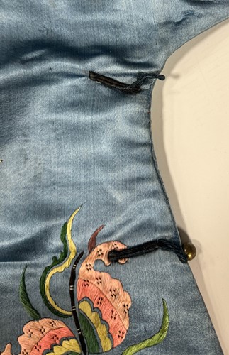 Lot 20 - A Chinese child's blue silk embroidered jacket, early 20th century