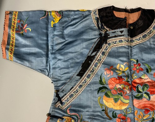 Lot 20 - A Chinese child's blue silk embroidered jacket, early 20th century