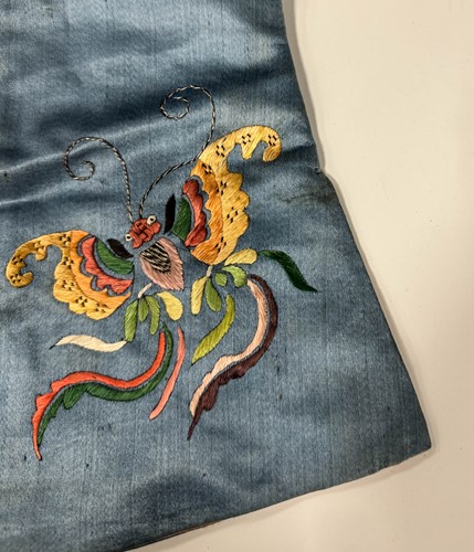 Lot 20 - A Chinese child's blue silk embroidered jacket, early 20th century
