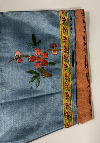 Lot 20 - A Chinese child's blue silk embroidered jacket, early 20th century