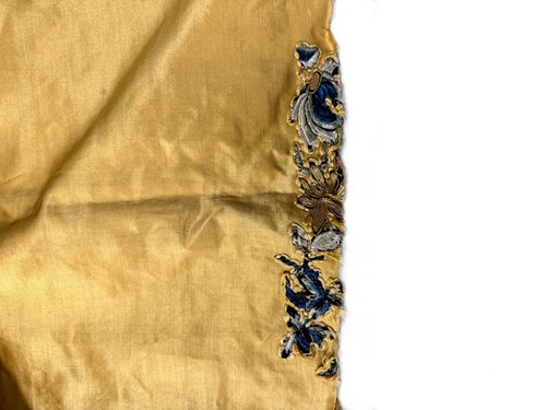 Lot 20 - A Chinese child's blue silk embroidered jacket, early 20th century